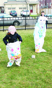 There were plenty of fun-loving people out Saturday for the second annual SouthFields Village Easter Egg Hunt. While everyone was on the lookout for the eggs, there were other exciting activities. Ryann Lopez, 5, found herself in a sack race with the Easter Bunny. Matthew Meikle, 23 months, got a chance to practice his soccer skills. There were plenty of games going on. Erica Korolidis, 2, was trying her skill with this one. Photos by Bill Rea