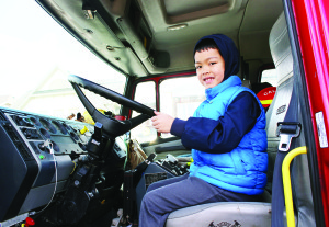 Representatives of the local fire hall were on hand Saturday with one of their trucks. Naveed Alli, 7, got the chance to experience things from the driver's seat.