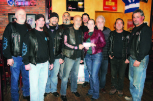 CONTRIBUTION FROM THE HURT'N OLD GUYS Fiona Ott, director of fundraising and communications for Caledon Community Services, was recenlty on hand to receive a contribution of $2,800 from The Hurt'n Old Guys, who get together Wednesday nights during the summer at St. Louis Bar and Grill in Bolton. On hand for the presentation were Greg Niedra, Dennis Bishop, Steve Moricz, President Fern Doria, Tom Garofalo, Silvano DeMarco, Lee Kirkby, Randy Kada and Robert Abballe. The group's first meeting of the coming season will be May 21, from 7 to 9 p.m. Photo by Bill Rea