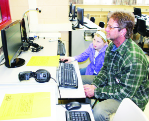 Grade 5 student Emily Hicks was giving her father Steve some pointers on the computer.