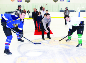 Acting mayor Rob Mezzapelli dropped the puck in the opening ceremonies Sunday night in the Face-off for Families charity hockey event. Sergeant Mike Dolderman took the drop for the OPP Road Runners, facing Marc Anthony Carbone for the Garden Foods Grinders.