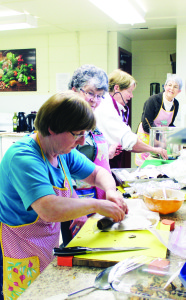 LOCAL FOOD TO CELEBRATE EARTH DAY Earth Day was celebrated Saturday at Palgrave United Church by a supper, featuring locally grown food, followed by a discussion on what is the dream environment in Caledon. In charge of the food preparation in the kitchen were Adelle Leaney-East, Lorraine Witty, Linda Brown and Ann Roxburgh. Photo by Bill Rea