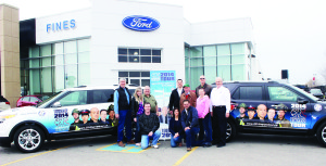 Heroes Are Human founder and executive Director Vince Savoia (third from left) was joined by various supporters recently at Fines Ford Lincoln, including advisor and former police officer Gary Wiles, media and public relations advisor Erin Alvarez, paramedic Rick Trombley, Natalie Ritacca, Fines Ford General Manager Carlos Martins, Michael Quinn of Signs Solutions, Paul Januszewski, paramedic volunteer Paula Trombley and tour logistics coordinator Derrick Allday. Photo by Bill Rea