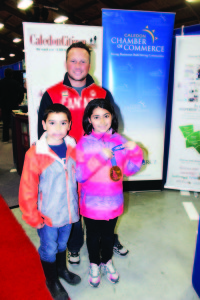 Olympic Gold Medalist and Caledon resident Caleb Flaxey was on hand for the first night of the Caledon Home and Lifestyle Show, showing the gold medal he received as a member of the men's curling team at this year's Olympic Games in Sochi. Julia De Caria, 9, and her brother Luca, 7, of Bolton were among those who got to see the medal close up.