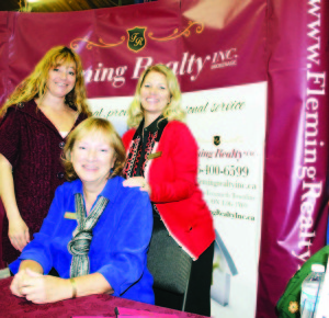 Karen Atkinson, Maureen Bruce and Sarah Fleming had plenty of information to offer at the Fleming Realty booth.