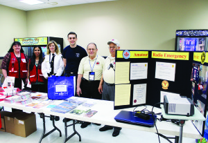 EMERGENCY PREPAREDNESS WAS CELEBRATED Caledon Fire and Emergency Services was helping to mark Emergency Preparedness Week with information displays throughout the community last week. There were displays at the Walmart, Home Depot and Canadian Tire stores in Bolton. Set up here Friday evening at Walmart were Tammie Ebel and Shelly Arora of the Red Cross; Gillian Boyd, public education officer with Caledon Fare and Emergency Services and volunteer Joseph Colonna; and Pierre Mainville and Richard Upfield, representing Amateur Radio Emergency Service. Photo by Bill Rea