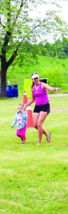 Kristen Proulx of Erin was helping Charly, 2, find the finish line.