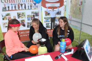 Lauren Bristoll, Mel Karpenko and Ally Kufrin were helping to blow up balloons at Caledon Community Services' booth.