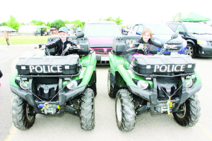 Caledon OPP had some of their special vehicles on display Saturday, and Julian Byle, 3, and his sister Eve, 5, from Caledon East were getting a feel for them.
