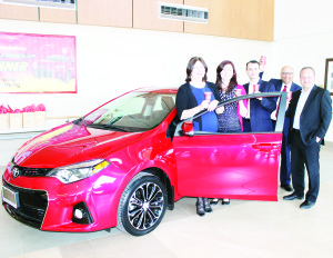 Deborah Armstrong took possession of her new car last Thursday, accompanied by her daughter Caitlin, Bolton Toyota General Manager Sid Anidjar, Sanjiv Seth of Dana Hospitality and Bolton Toyota General Sales Manager Mike Rietta. Photo by Bill Rea