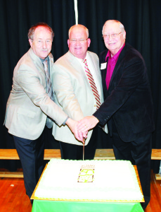 This ceremonial cake was cut by Trustee Stan Cameron, Principal Tim Pederseen and former teacher Harry Smith.