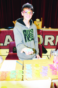 Paul Howe, 14, was showing a collection of Origami Frogs he made of paper.