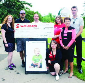 GREAT GOLF IN MULLIGANS FORE MATTHEW A good crowd of golfers was out recently for the second annual Mulligans Fore Matthew at Caledon Country Club. This fundraiser for Cysitc Fibrosis Canada has been organized by Matthew's parents Adam and Gillian Maramieri of Valleywood. Matthew, 2, was diagnosed with the deadly disease shortly after his birth. His parents report the event this year raised $30,700, which was a big increase from the $17,000 raised last year. They also said Scotiabank contributed $5,000. Seen here, surrounding a picture of Matthew, are Gillian and Adam Maramieri, Graham Hill of Cysitc Fibrosis Canada and Lucy Sanzo, Karen Marciano, Danila Maric and Matt McClure of Scotiabank. Photo by Bill Rea