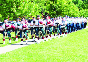 Members of the Sandhill Pipes and Drums and 16 Wing from Canadian Forces Base Borden marched into Saturday's opening ceremonies of the Peace Park.