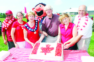 Things started early at Downey's Farm Market with a celebration, complete with Mayor Marolyn Morrison cutting this ceremonial birthday cake, accompanied by Councillor Gord McClure, Darlene Downey, farm mascot Dudley, Dufferin-Caledon MP Davod Tilson and MPP Sylvia Jones, and Councillor Allan Thompson. Photos by Bill Rea