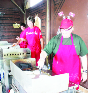 Canada Day celebrants at Downey's were able to take in a Pancake Breakfast. Those handling the cooking duties included Kevin McPherson, Joanne Armstrong and Lynne Howard.