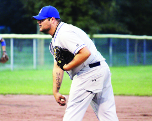 Dodgers pitcher Ron DiPalma sets up before delivering a pitch against the Aurora Jays in Bolton last week. DiPalma pitched a solid game, but the Dodger's offense wasn't behind him in a 4-0 loss.