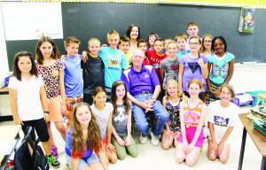 GOODBYE MR. STEGEMAN Ellwood Memorial Public School's retiring principal John Stegeman insisted on being photographed with students his last day on the job. “It has been an amazing journey,” he had previously stated in his retirement speech as he reflected on 55 years he's been in school, both as a student and teacher. He was principal at Ellwood for seven and a half years. “I couldn't have wished for a better school to retire from because every day was a great day at Ellwood Memorial.” He also said in retirement, he plans to travel with his wife, try to play some golf, read and continue volunteering in town. Photo by Bill Rea