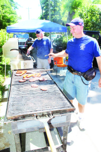 There was lots of food available, courtesy of the local firefighters. George Newhouse was among those handling the barbecuing chores.