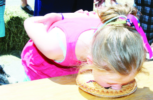 What would Cheltenham Day be without the Pie-Eating Contest. Clara Cahill, 9, of Milton was showing her prowess in the heat for the younger set. Her talent must run in the family, because her father Tom took the championship.