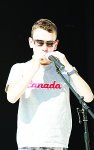 Rory McDonald played O Canada on his harmonica to open Saturday's ceremonies.