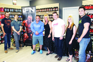 BODY BUILDING PRO IN TOWN International Federation of Bodybuilding and Fitness pro and iForce Nutrition athlete Jose Raymond paid a call recently at Amped Nutrition in Bolton. He is seen here with store customer Bryan Alderdice, Owner Luke Bernardi, Customers Sharon Trickett, D.J. Austin and Taylor Trickett and John Finnegan of iForce Nutrition. Photo by Bill Rea