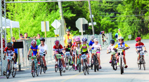 These young folks, aged eight to 10, were taking off on the one-lap Youth Road Race.