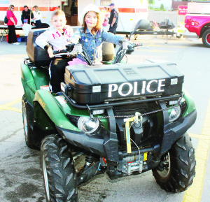 Caledon OPP had some of their equipment on display. Christina Grieco, 6, and her brother Nicholas, 3, were trying out this four-by-four Quad.