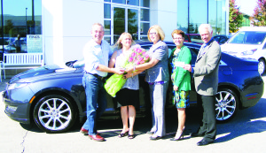 DRAW WINNER GETS HER CAR Tracey Wallace of Erin (2nd from left) received the keys to the Lincoln Hybrid, won in the recent lottery to benefit Bethell Hospice. The draw was held at Bolton Fall Fair. On hand were Bob Fines of Fines Ford Lincoln, Jeannette Vanden Heuvel and Danila Maric of Bethell Hospice Foundation and Erin Rotary president Rod Finnie. Photo by Mark Pavilons