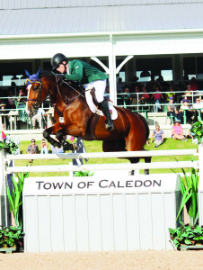 Conor Swail guides Ariana over oneof the fences in the jump-off, posting a clear round to win the $50,000 World Cup Grand Prix. Photos by Bill Rea