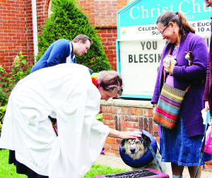 BLESSING THE PETS Sunday saw a Blessing of Animals service at Christ Church in Bolton. Sandi Wiseheart's pet Buddy, a rescue dog, was blessed by Rev. Riscylla Shaw. Photo by Angela Gismondi