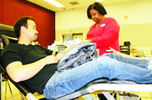 BLOOD IS IN SHORT SUPPLY Canadian Blood Services reports there is a shortage of blood, and they are encouraging people to help out and make donations. There was a clinic at Caledon Community Complex last Thursday, where Palgrave resident Tan Tran made a contribution, assisted by Sylvia Lawrence, and there will be others Dec. 4 and Feb. 2, from 3:30 to 6:30 p.m. There are also clinics held a the second Tuesday of every month at Albion-Bolton Community Centre. “We are in great need, very much so,” said Event Co-ordinator Clara Angumba. Photo by Bill Rea