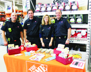 INFORMATION FOR FIRE PREVENTION WEEK Representatives of Caledon Fire and Emergency Services were on hand last Saturday at the Home Depot store in Bolton, distributing information for Fire Prevention Week. Seen here are Firefighter Chris Lomas, Fire Prevention Officer Scott Gilbert, Public Education Officer Gillian Boyd and Captain Phil Donovan. Photo by Bill Rea