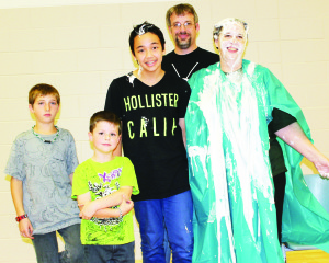 Students raised more than $1,800 in the recent Terry Fox Run, and the top money raisers among the students were given the honour of letting Breen have it with a pie in the face. The principal is seen here at the right, with Gradon Knox, who was the top money raiser in the junior division with $50, primary student Logan Collins, who raised $225, intermediate student Ryan Jay, who raised $97, and teacher-librarian Pattri