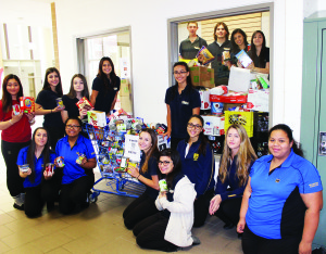 SUCCESSFUL FOOD DRIVE AT ST. MICHAEL Members of the world's issues class at St. Michael Catholic Secondary School in Bolton were showing off the results of their Thanksgiving food drive, which was declared the most successful one in the school's history. More than 3,200 pounds of food were collected for the Exchange in Bolton. Photo by Bill Rea