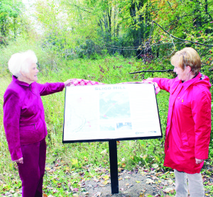 There was a small but pleased crowd out last week for the official unveiling of this sign on the Caledon Trailway on the west side of Highway 10, marking the location of what used to be known as Sligo Hill. Sligo Hill resident Helen Hamilton and Mayor Marolyn Morrison were on hand fo the unveiling. Photo by Bill Rea