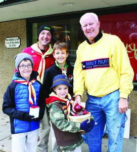 Saturday was Apple Day for the various Scout organizations in Caledon. Scouts, Cubs and Beavers were outside various establishments in town in this annual fundraiser. Mark Prier of the 1st Caledon East Scouts was accompanying his sons Bryce, 6, Tyson, 10, and Kyle, 12, as they made an Apple Day sale to Gerry Byle of Caledon East.