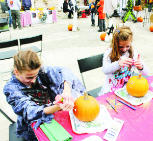 Alton Mill was a busy place again Sunday with a family festival to celebrate this scary time of year. There were all sorts of fun a creative activities going on at Frightapalooza. Brooke Freingruber, 13, and Paige Angot, 11, of Alton were busy decorating pumpkins.