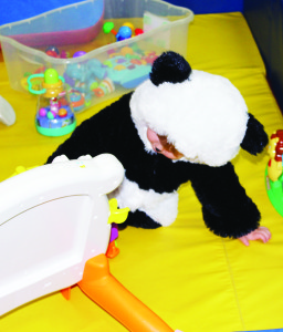 Emmett McNamara, 2, was finding his way through a collection of neat toys in his panda constume. Photos by Bill Rea