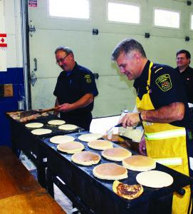 The Alton firefighters hosted their annual open house last Saturday, inviting the community in. The activities included a pancake breakfast. Firefighter Brian Ewles and Captain Don Rea were busy at the grill. Photos by Bill Rea
