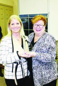 Sarah Fleming accepted the Business of the Year Award from Chamber Board Chair Valerie Arnold-Judge.