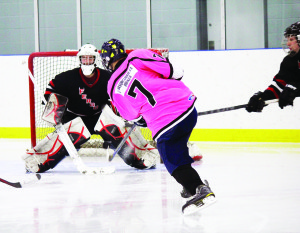 Adam Breen snaps home a goal in last Friday's 4 - 1 win over the Fergus Devils. Photo by Jake Courtepatte