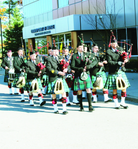 Two services to remember those who served and died for Canada were held Sunday at the Cenotaphs in Caledon East and Mono Mills. Members of the Sandhill Pipes and Drums were leading the parade past Town Hall. Photos by Bill Rea