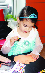 CELEBRATING HALLOWEEN EARLY There was lots of fun to look forward to Halloween night Friday, but some local youngsters were able to get an early start through the Halloween Fun at the Village Cafe, presented by the Caledon Parent-Child Centre at the Exchange in Bolton. Vera Stathakis, 3, of Bolton was having a fun time with the crafts. 