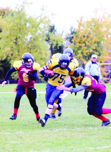 HUMBERVIEW HOSTS MAYFIELD Humberview Secondary School's new football program was tested by their foes from Mayfield Secondary School last Thursday. Here, Mayfield's Michael Straughen picks up a first down as his side picked up the win. Photo by Bill Rea