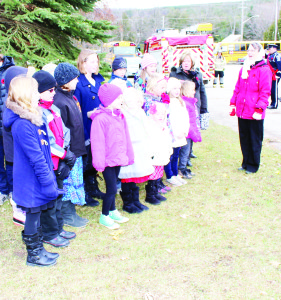 The Alton Public School choir, under the direction of Judith Phillips, sang the anthems at Sunday's service in Alton.
