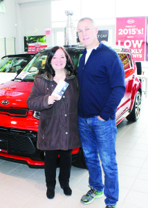 TICKETS TO SEE THE LEAFS Paul Coffey of Bolton Kia presented Caledon East resident Marie Romolo Saturday with two tickets for the Toronto Maple Leafs' match Tuesday against the Nashville Predators. She was the winner in a monthly draw among people who take a vehicle for a test drive. She wasn't able to pass her luck on to the Leafs Tuesday night. The Buds fell 9-2 to the Predators. Photo by Bill Rea