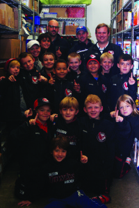 Members of the Caledon Hawks novice AA team recently received a lesson in something other than hockey. The team spent an evening at the Exchange in Bolton, getting some insights in the work being done there, and learning about why the Hawks for Hunger event really helps out the Exchange with the generosity of the Caledon hockey community. The players received a tour of the facility and got to participate in various activities that keep the Exchange running, such as sorting and storing food items. Photo submitted