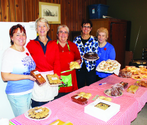 CRAFT AND BAKE SALE Knox United Church in Caledon village hosted their craft and bake sale recently. Those pitching in a the baked goods table included Jessica Ruth, Judy Peeling, Sue Kyle, Cindy Johnston and Liz Wylie. Photo by Bill Rea
