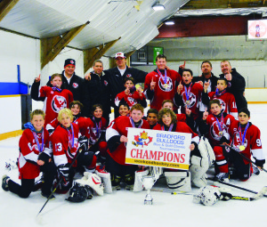 PEEWEE HAWKS WIN BRADFORD TOURNAMENT Over a recent weekend, the Caledon Hawks peewee AE hockey team captured the Bradford Blue and Gold Classic championship in true style. Suffering only one round-robin loss, the Hawks played tremendous defensive hockey and received excellent goaltending in allowing a mere seven goals against in five games. In the semifinal game against the Meadowvale Hawks, center Liam Bavington snapped a high wrist shot past the outstretched glove of the goalie, in Triple OT, to win in dramatic fashion by a 2-1 score. In the final versus the Belle River Canadiens, the Hawks gained an early lead and never looked back. They fore-checked strongly, out chancing the opposition in all three periods en route to outshooting the Canadiens 29-15. The entire team back checked well and played solid defence as the Hawks went on to beat the Canadiens 4-1 in the AE Championship Game. The Hawks goal scorers were Garrett Graham, Liam Bavington, Thomas McClure and Evan Patterson. Goaltender Lucas Hillert earned the well-deserved victory, while defenceman Adam Hauck earned player-of-the-game honours. Seen here are (back row) Thomas McClure, Jim Morris (head coach), Norm McClure (coach), Chris Hillert (coach), Adam Hauck, Liam Bavington, Nikolas Viveiros, Mart Mihkelson (coach), Garrett Graham, Trevor Oake (coach), (second row) Calvin Oake, Eamon Lowe, Tyler Mihkelson, Evan Patterson, Mark Sharples, Dylan Heida, Marco Costabile, (front row) Kyle Rochester, Jack Morris, Joey Dowds and Lucas Hillert.